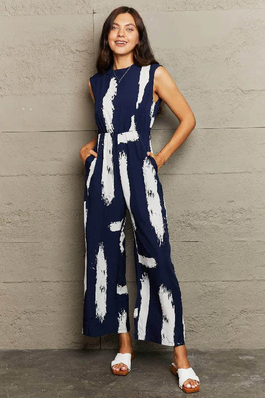 Printed Round Neck Cutout Jumpsuit with Pockets Bold print jumpsuit, Trendy, Chic, Casual Printed Round Neck Cutout Jumpsuit with Pockets Bold print jumpsuit, Trendy, Chic, Casual